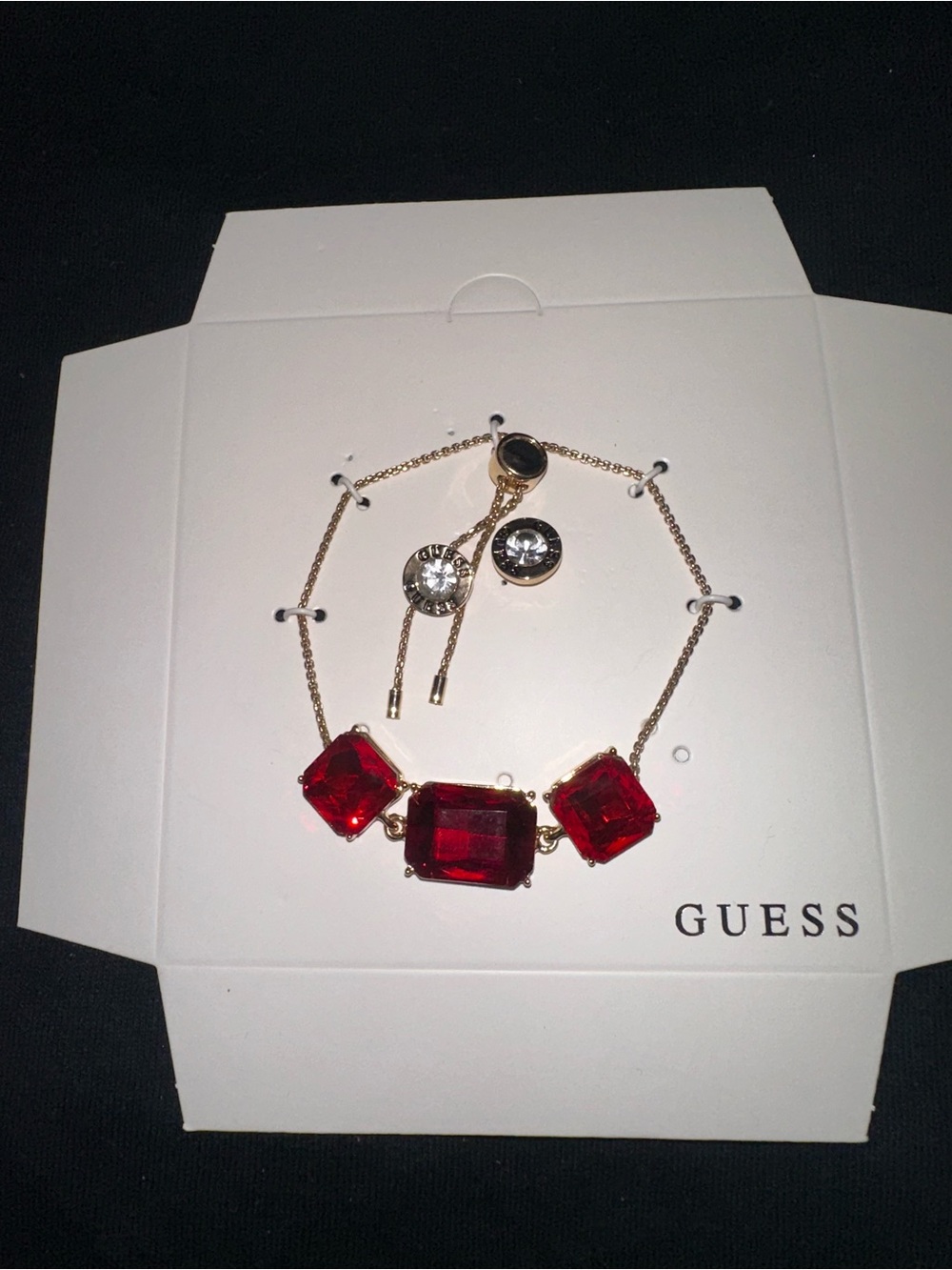GUESS Gold-Tone Bracelet with Red Faceted Stones